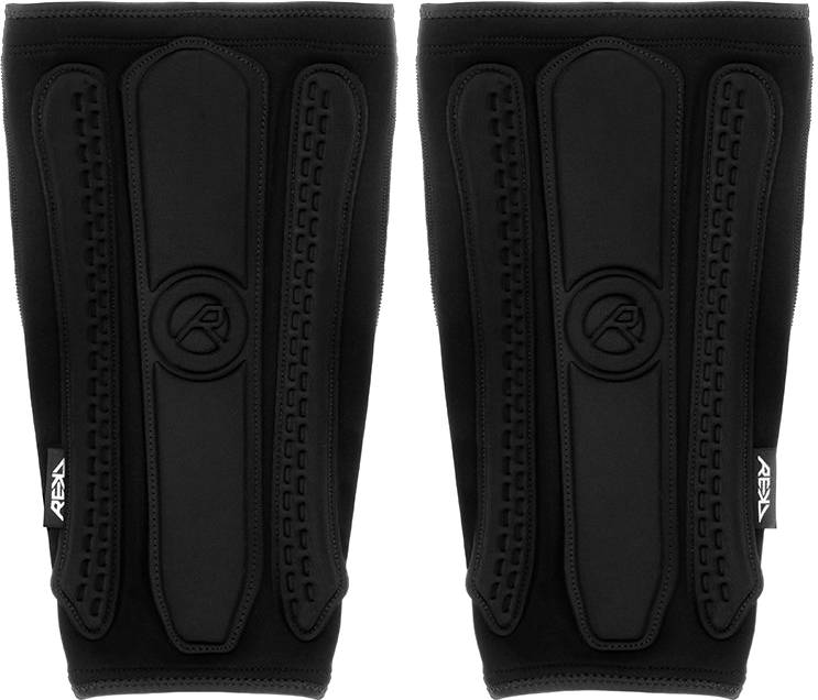 REKD Energy Covert Long Shin Skate Protection Guards in slim black, featuring padded vertical segments with a logo embossed in the center.