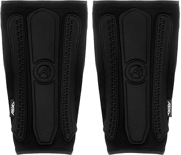 REKD Energy Covert Long Shin Skate Protection Guards in slim black, featuring padded vertical segments with a logo embossed in the center.