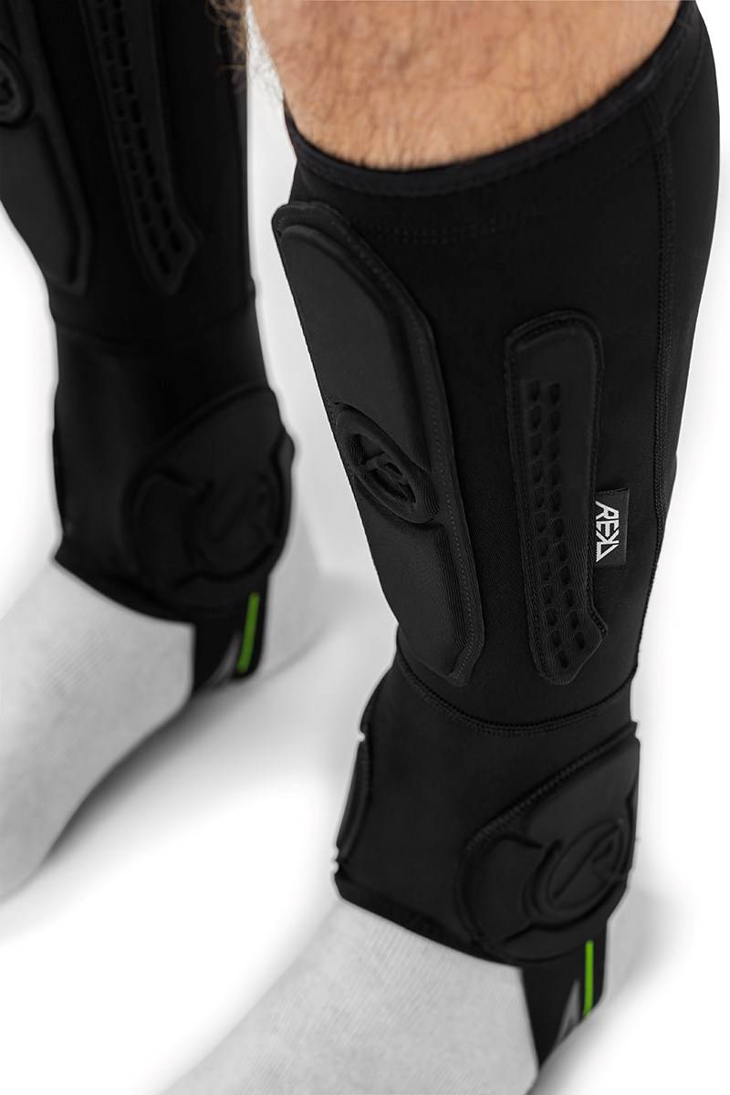 Black REKD Energy Covert Short Shin and Ankle Skate Protection Guards worn on the lower legs for BMX protection.