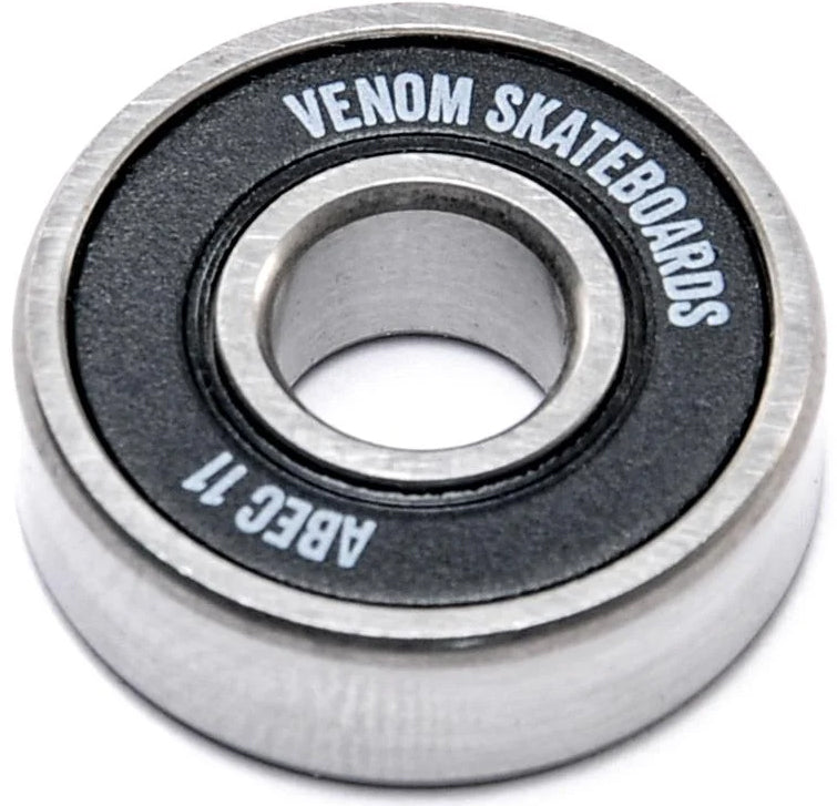 A single Venom ABEC 11 Skateboard Bearings with a metal inner ring and a black rubber seal printed with “VENOM SKATEBOARDS” and “ABEC 11.”