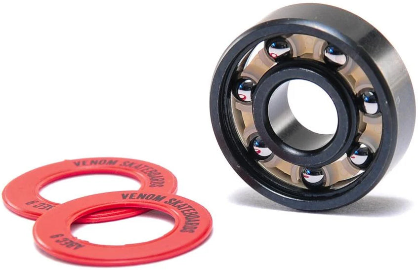 A metal Venom ABEC 9 Skateboard Bearings with a black outer ring and two red circular shields labeled “Venom Skateboards” and “ABEC 9.”