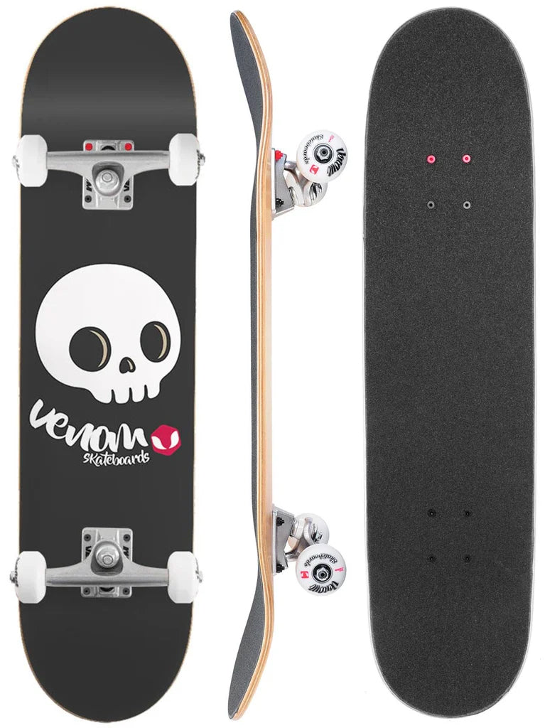 Three views of a Venom Junior Skull Black Kids Complete Skateboard - 7.25″ x 29″: the underside with a white skull graphic, the side profile showing trucks and wheels, and the top covered in black grip tape.