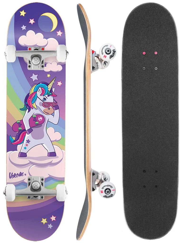 Three views of a Venom Junior Unicorn Night Kids Complete Skateboard - 7.25″ x 29″ showing a cartoon unicorn wearing sunglasses and holding a small skateboard over a rainbow and purple night sky, with a black grip-taped top.