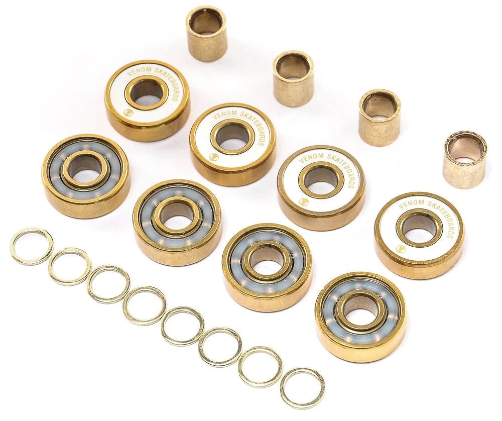 Venom Precision Gold Skateboard Bearings pack including eight bearings with internal balls, eight metal spacers, and eight rubber washers.