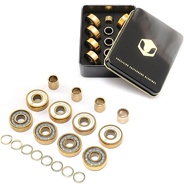 Venom Precision Gold Skateboard Bearings - 8 Pack, including eight small metal spacers, eight thin washers, and a black metal storage tin containing additional parts.