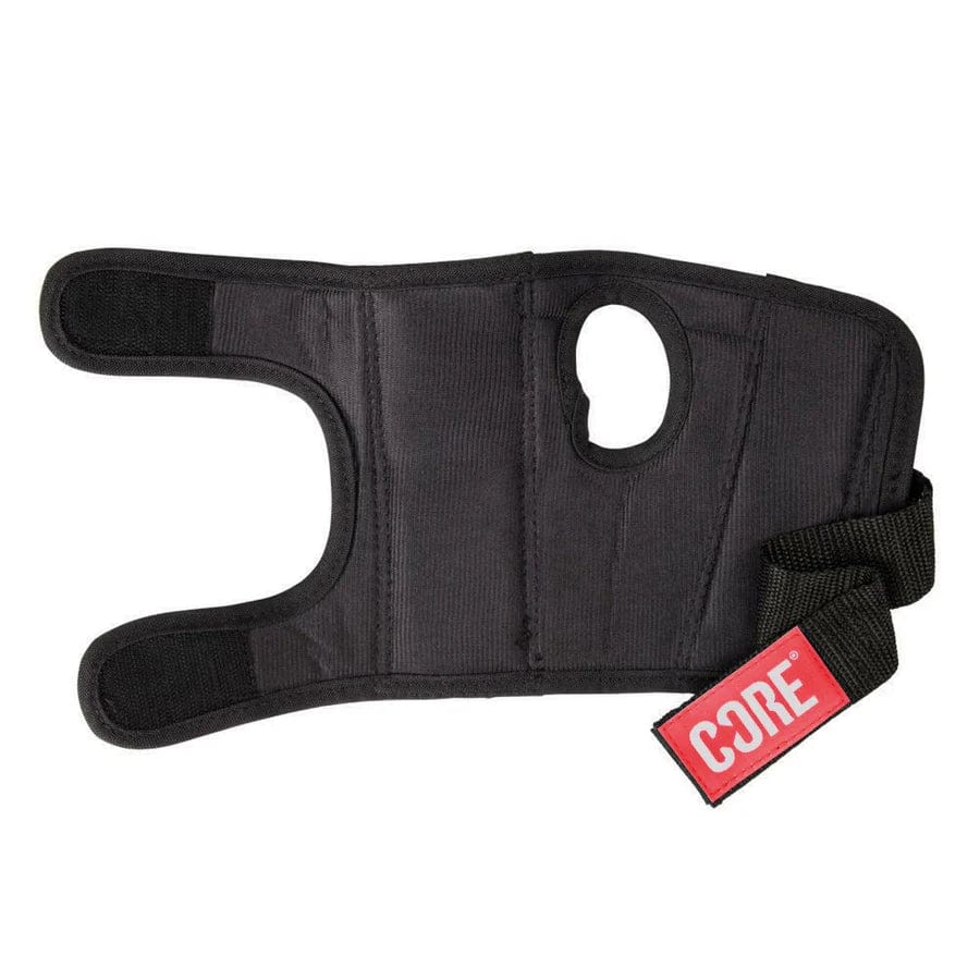 The CORE Classic Skate Protection Wrist Guards in black feature a neoprene construction with an open thumb hole and an adjustable strap. They include a red tag that reads "CORE Protection" and provide support and compression with a reinforced splint for added stability, offering the protection of skate wristguards.