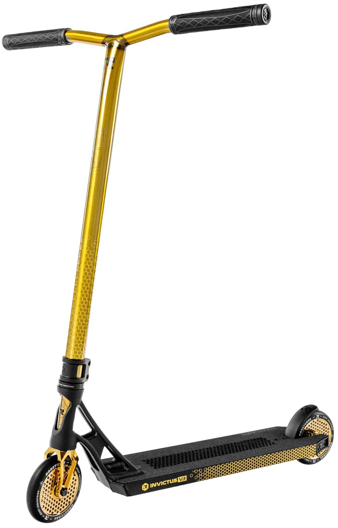 The Root Industries Invictus V3 Complete Stunt Scooter - Burnt Gold features T-shaped handlebars, a perforated Honeycore gold front wheel, “INVICTUS V2” branding on its black deck, and a sleek, modern design.