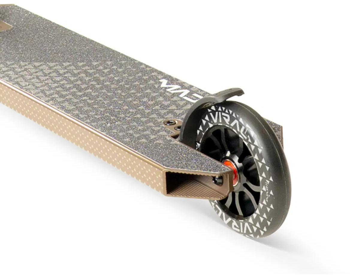 Close-up of the Madd Gear Viral KAOS Complete Stunt Scooter - Ash shows the rear wheel with a black rim and white graphics, a small rear fender, and a textured deck for grip.