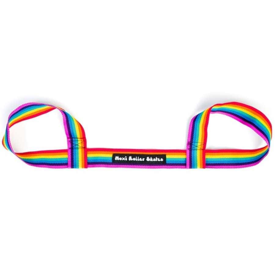 The Moxi Roller Skate Leash - Rainbow by Moxi is a colorful strap with loops on each end, highlighted by a black label that says "Moxi Roller Skates." This convenient skate holder allows you to carry your gear stylishly.