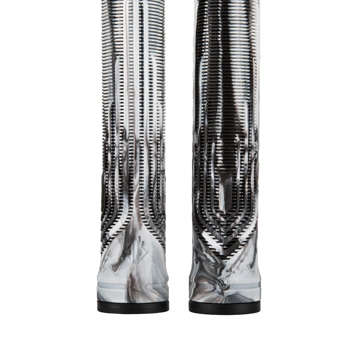 Close-up view of two intricately designed, tall sculptural objects with a reflective, metallic surface and vertical ribbed patterns, featuring a blending of silver and black hues. The futuristic pattern evokes the sleek aesthetics of the Drone Acolyte Black / White Marble Stunt Scooter Grips - 180mm by Drone.