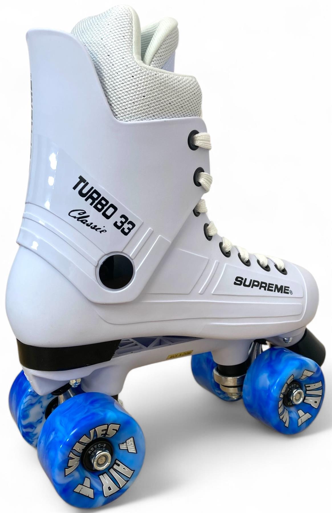 The Supreme Turbo 33 Nylon Quad Roller Skates in white feature black laces, blue swirl wheels labeled "Wolves" and "HRB," and side branding, inspired by classic quad skates.