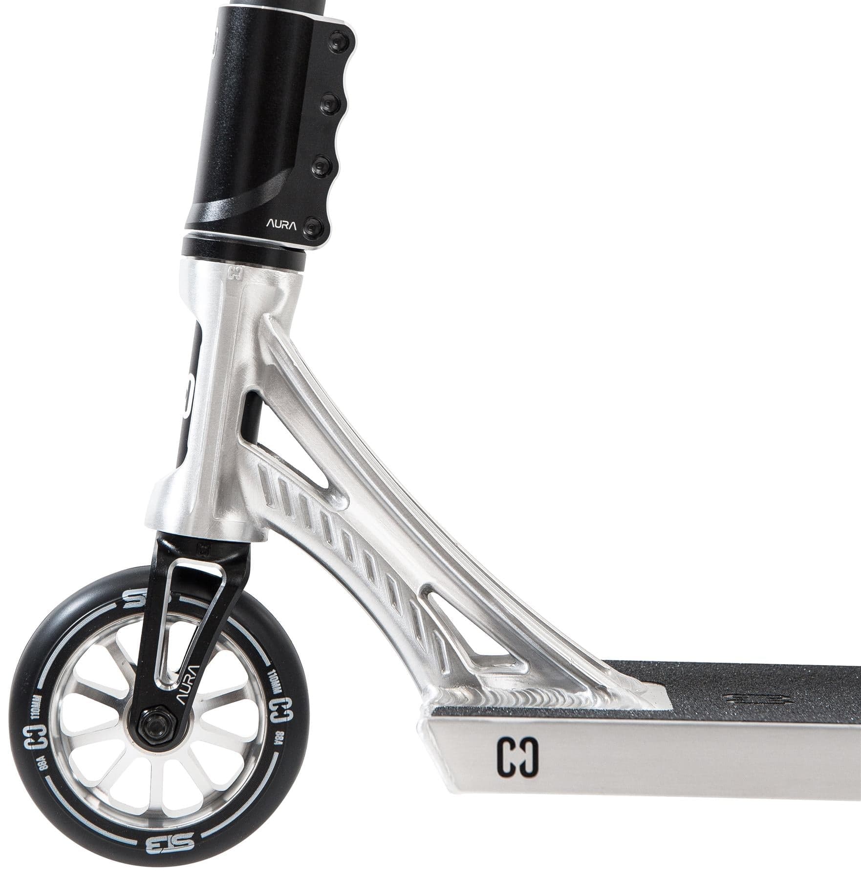 Close-up of the CORE ST3 Complete Stunt Scooter in polished silver, highlighting the front wheel, fork, and deck with a modern angular design and pro-grade components. Brand: CORE.