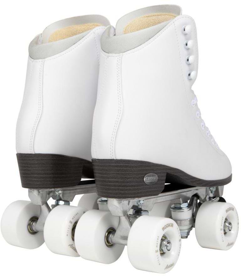 The Rookie Artistic Quad Roller Skates in white feature vegan leather high boots, white laces, brown soles, and white wheels. This pair from Rookie is shown angled from the back on a white background.