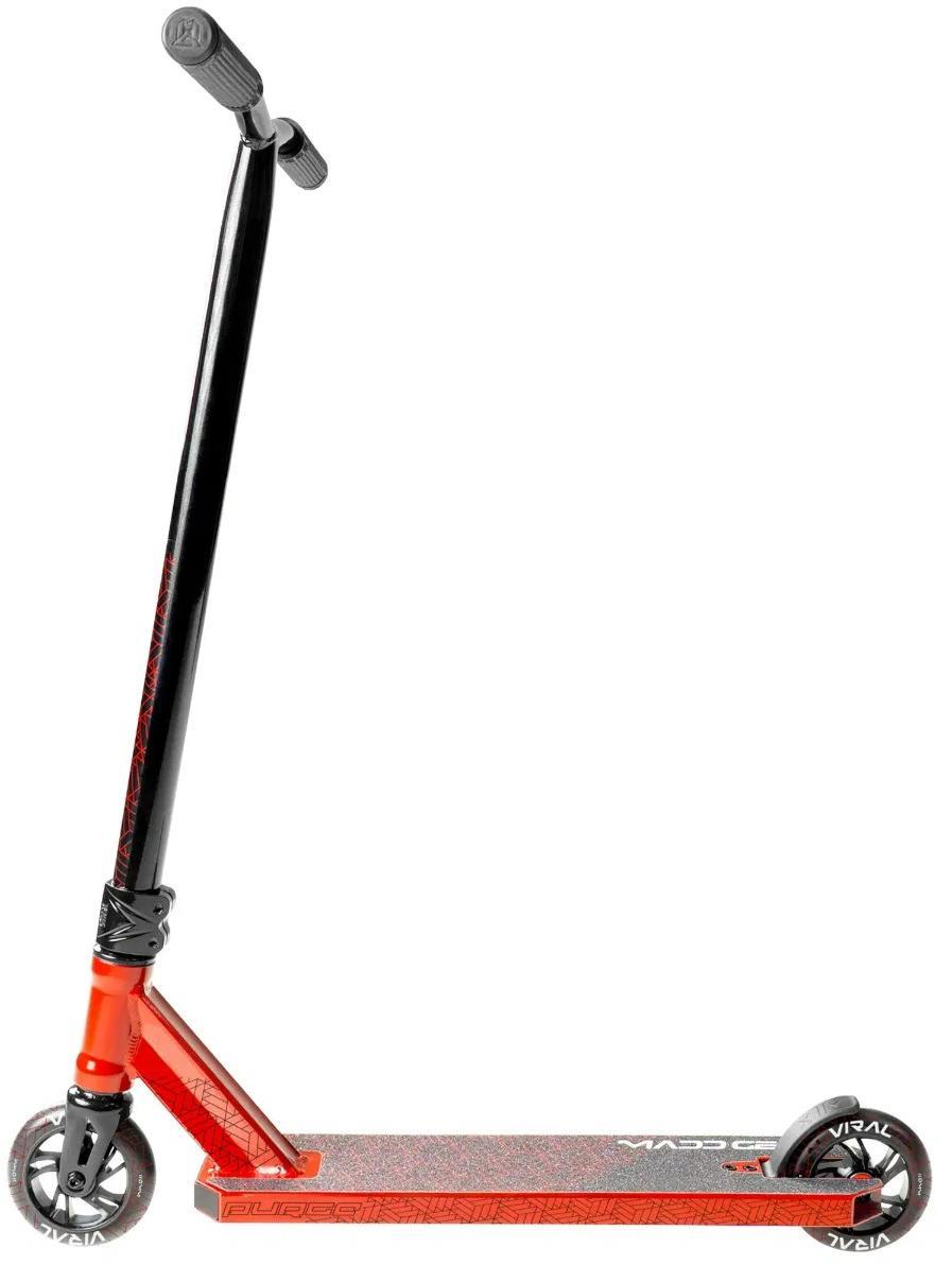 The Madd Gear Viral Purge Complete Stunt Scooter - Cherry features a textured foot deck, two small wheels, and upright handlebars—ideal for the skatepark. Shown here in red and black against a white background.