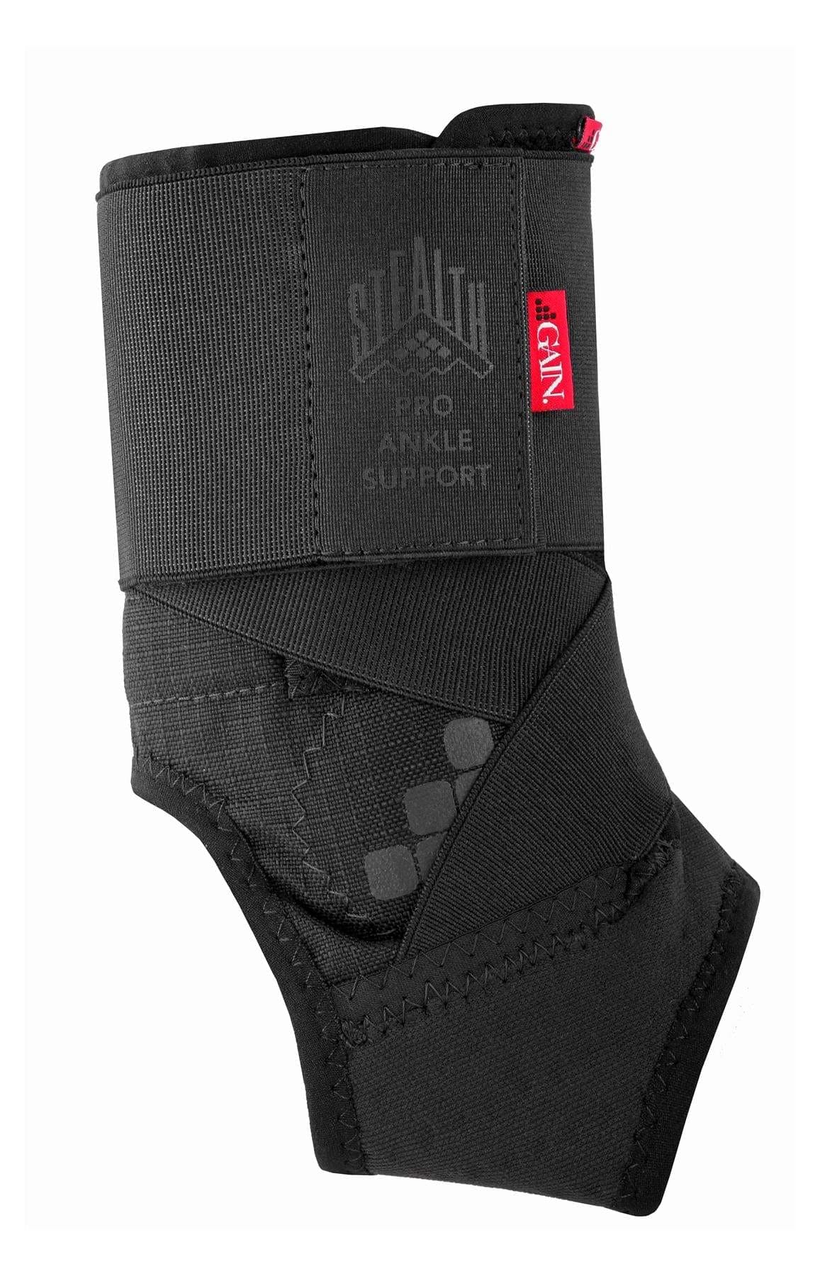 The GAIN Protection Stealth Pro Adult Ankle Support - Black features overlapping straps, visible stitching, and branding labels for stability, comfort, and impact protection during physical activities.