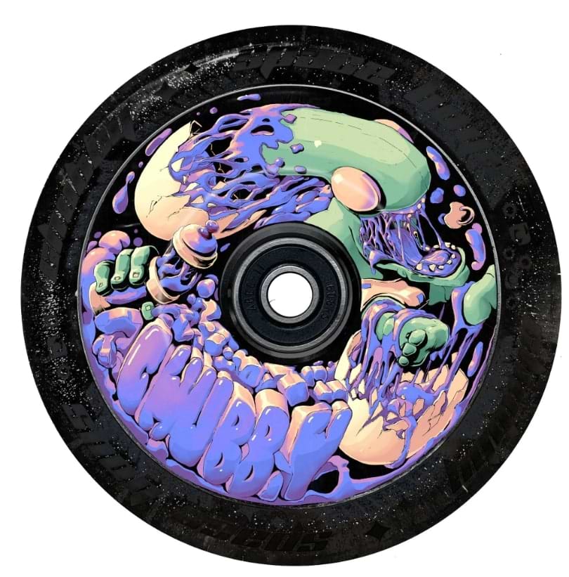 A vibrant, psychedelic design on the Chubby Baby Alien Purple 110mm Hollowcore Stunt Scooter Wheel showcases a melting green and purple creature with exaggerated features gripping the rim. The word "CHUBBY" prominently appears in purple letters at the bottom, reminiscent of these distinctive wheels.