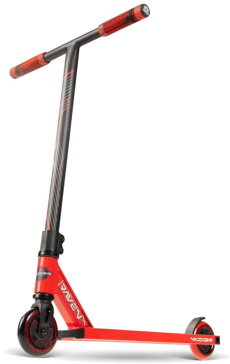 The Madd Gear (MGP) MG 1 Raven Complete Stunt Scooter in red and black for kids features two small wheels, a straight handlebar with grips, "Raven" and "Madd Gear" logos, and a larger front wheel for added stability.