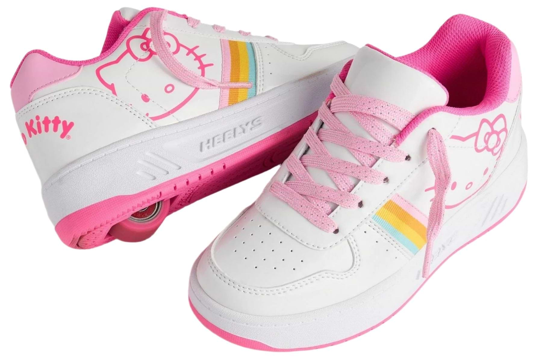 The Heelys x Hello Kitty Kama Girls Shoes in white and pink feature cute Hello Kitty designs, rainbow stripes, pink laces, and a retractable wheel in the heel for fun gliding. Brand: Heelys.