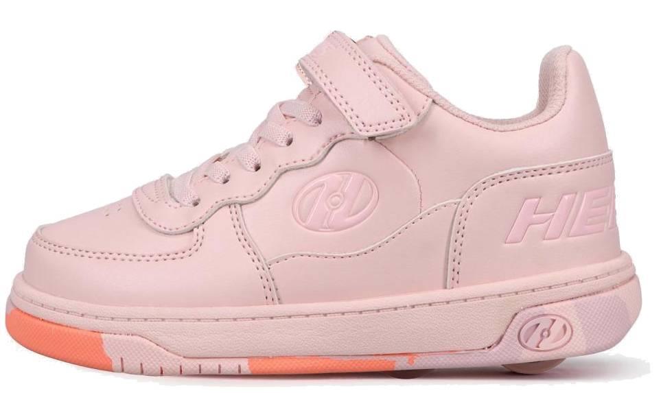 The Heelys Rezerve X2 Girls Shoes in Light Pink/Pink Confetti feature a Velcro strap, laces, side embossed logo, visible heel wheel, orange-accented sole near the toe, and a beginner-friendly design. Brand: Heelys.