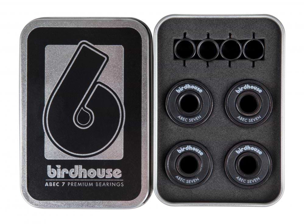 Open metal box featuring Birdhouse ABEC 7 Black Skateboard Bearings - 8 Pack. The left side prominently displays the Birdhouse logo and text, while the right side securely houses eight premium skateboard bearings in a protective foam insert.