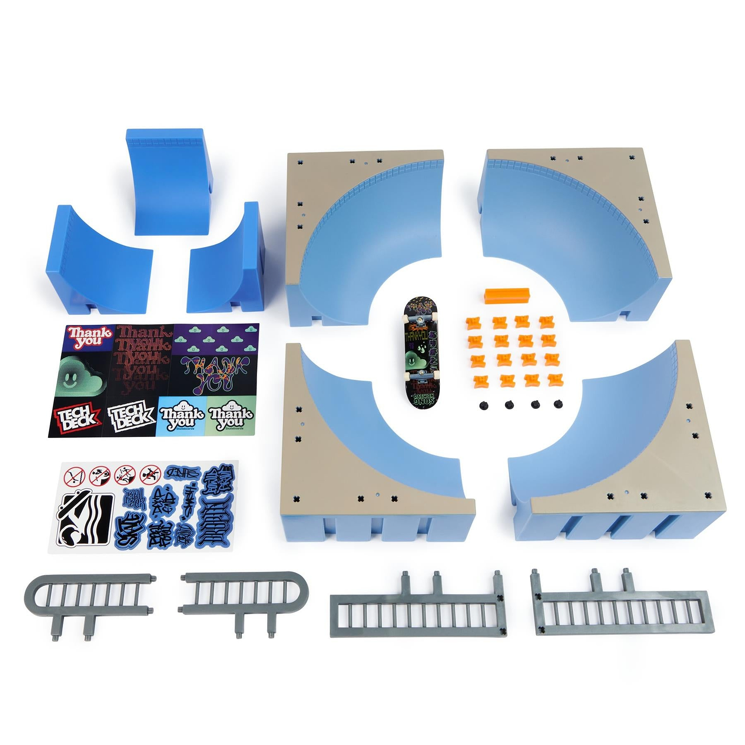 The Tech Deck X-Connect Fingerboard Daewon Mega Bowl by Tech Deck includes blue and beige ramp pieces, orange cones, a mini skateboard, stickers, rails, and barriers—perfect for building your own fingerboard skate park. Laid out on a white background.