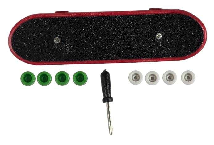 Displayed is a Finger Skateboard Toy in red and black grip tape from Skates.co.uk. Accompanied by a small screwdriver, it comes with four green and four white wheels arranged beneath it, ideal for fingerboarding enthusiasts or mini skateboarders.