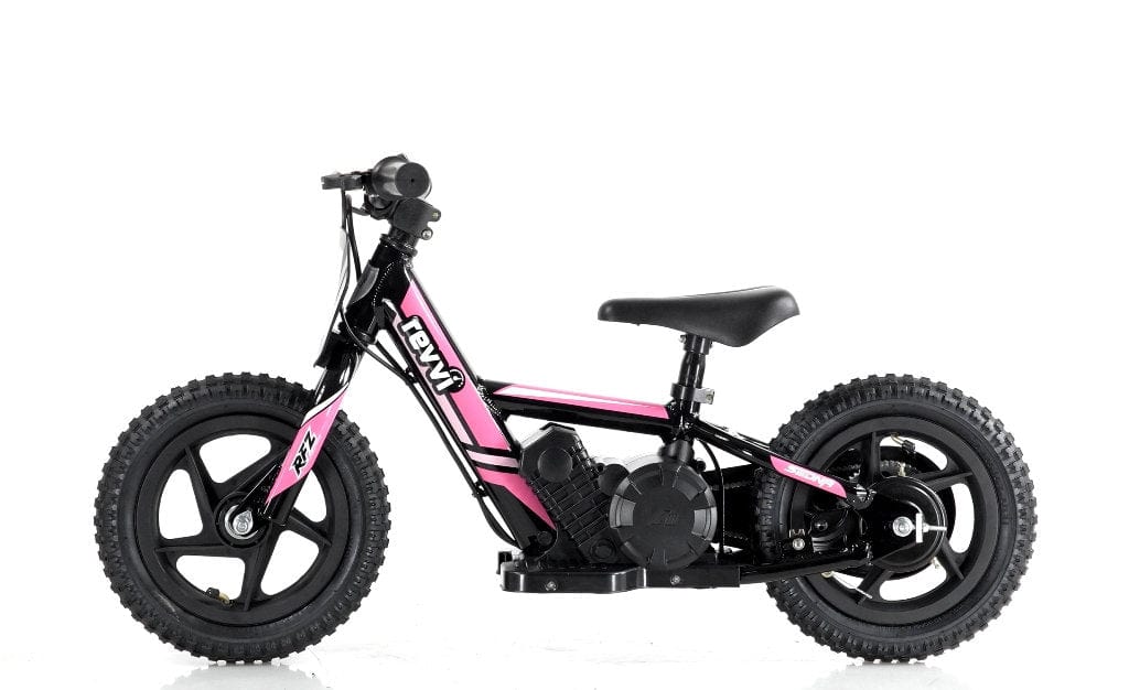 The Revvi 12" Kids Electric Balance Bike in pink, designed with a small size for children, stands against a white background. It features thick tires, a black seat, and handlebar grips. The frame is accented with black and decorative letter decals that suggest an electric-powered motorbike design.