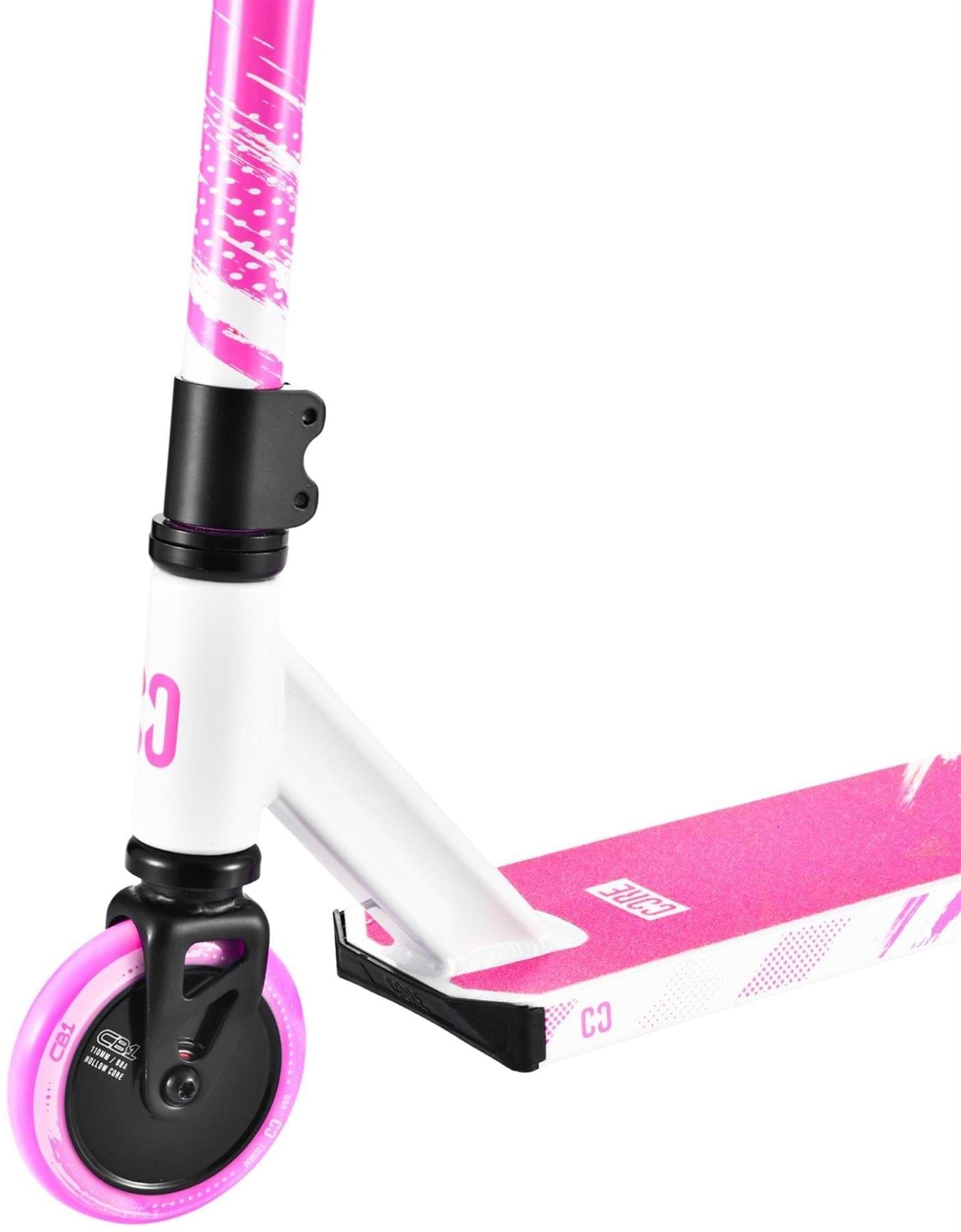 Close-up of the CORE CB1 Beginner Complete Stunt Scooter by CORE in White/Pink, highlighting the front wheel with pink accents, a deck featuring a pink grip surface and stylish white designs, plus part of the handlebar.