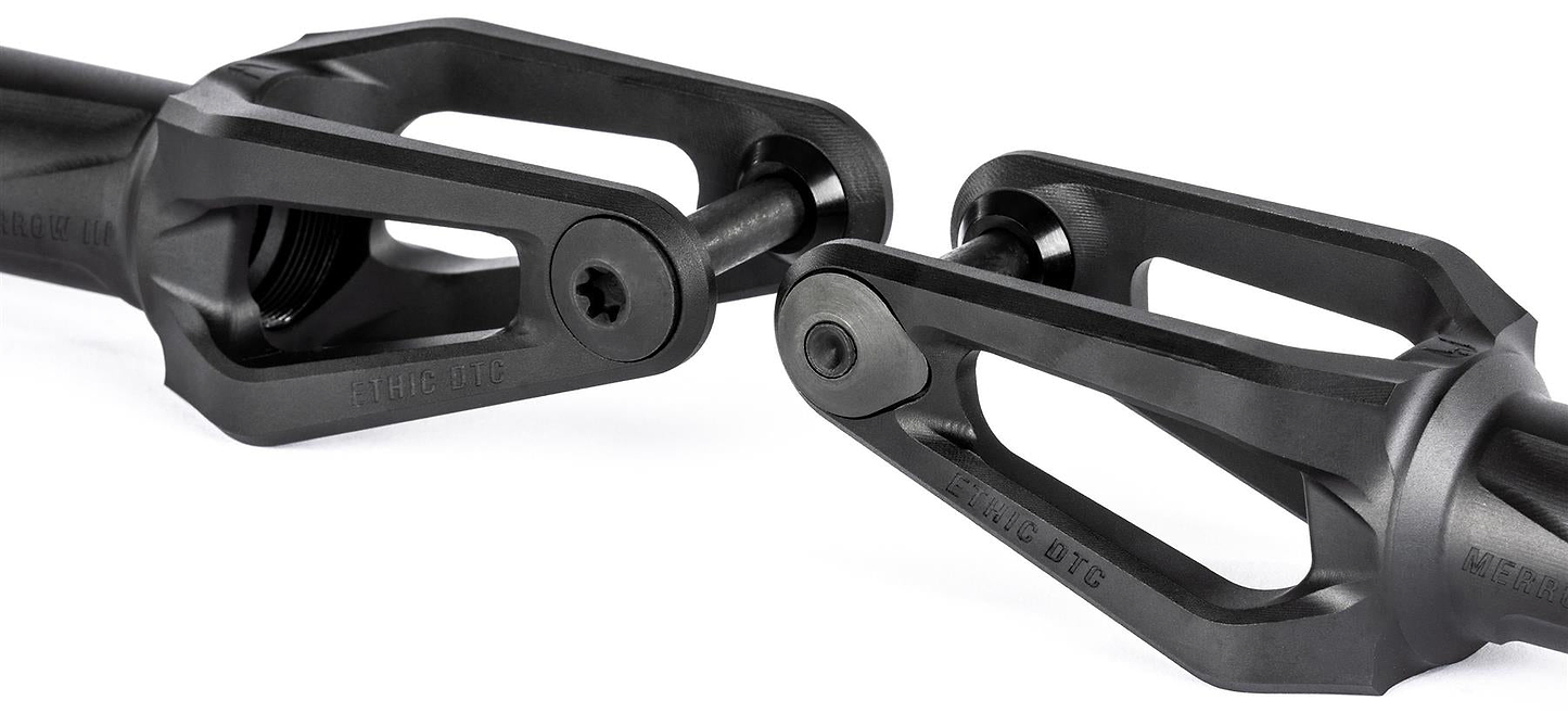 Two black Ethic DTC Merrow V3 8/12STD IHC stunt scooter forks with angular, open-frame designs are positioned facing each other. Each lightweight fork features a central bolt and has "Ethic DTC" branding on the surface.