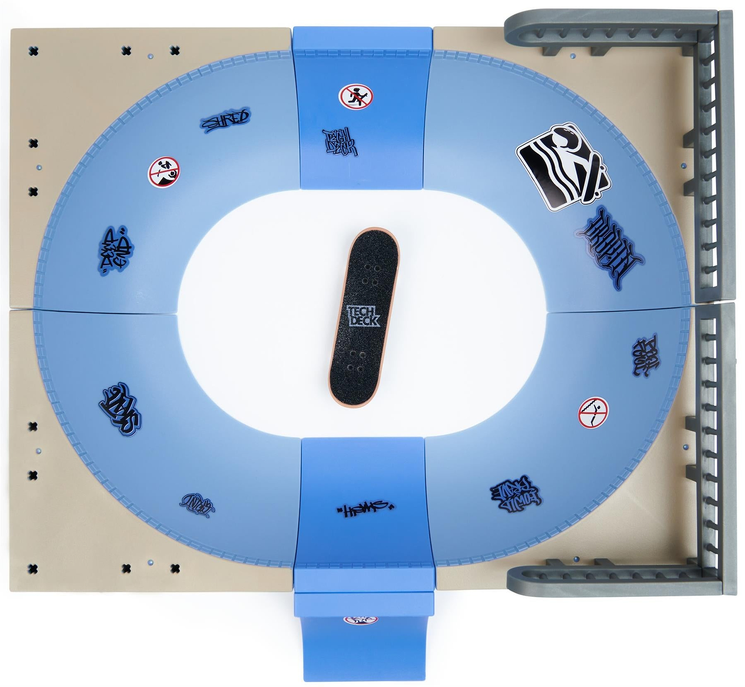 The Tech Deck X-Connect Fingerboard Daewon Mega Bowl is a blue and gray oval skatepark with ramps, rails, and graffiti. A black Daewon Song-inspired Tech Deck fingerboard sits in the center. Brand: Tech Deck.