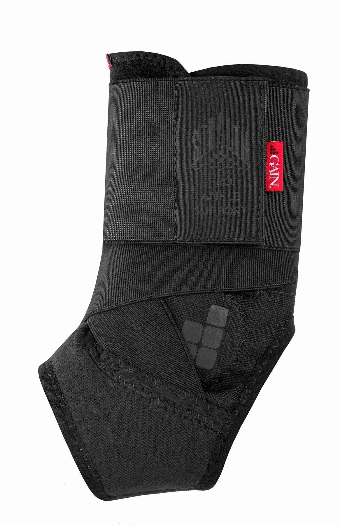 The GAIN Protection Stealth Pro Adult Ankle Support - Black features overlapping straps, a red "STEALTH ANKLE SUPPORT" tag, ergonomic stitched seams, and flexible impact protection for optimal ankle support.