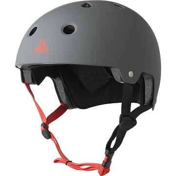 The Triple 8 Dual Certified Skate / Scooter Helmet in Gunmetal Grey features a red front logo, excellent airflow from multiple vents, adjustable black straps with red padding for a snug fit, and includes Sweatsaver™ Fit Pads for ultimate comfort.