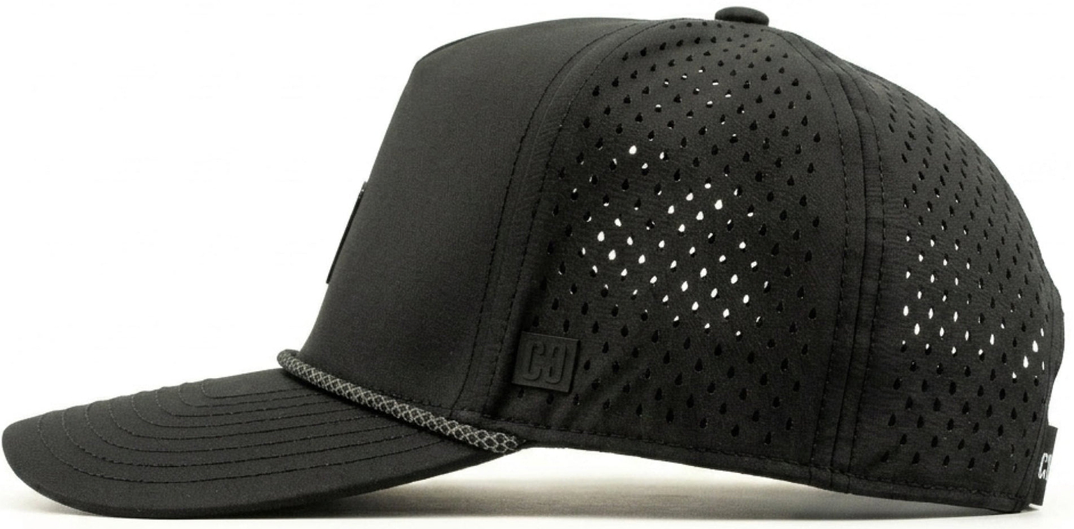 The CORE Aero Rope Cap - Black is displayed in a side view against a white background. This performance cap from CORE features a curved brim and ventilated, perforated side panels for enhanced breathability. Subtle CORE logo detailing complements its modern design.