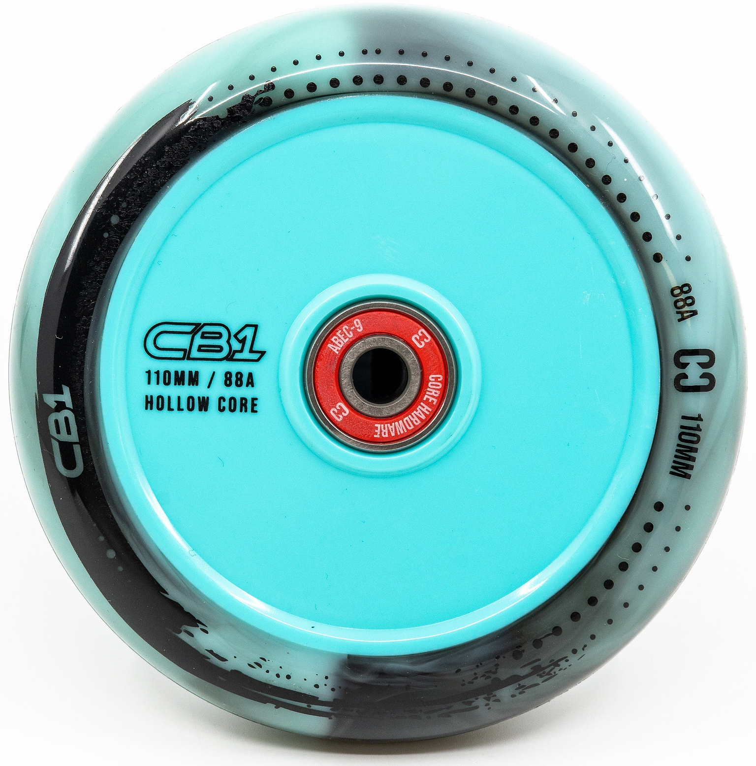 A close-up of a CORE CB1 110mm Nylon Scooter Wheel by CORE, shown in black and teal with “110MM / 88A” and “CORE HARDWARE” printed on it. This beginner scooter wheel features a striking red central hub.