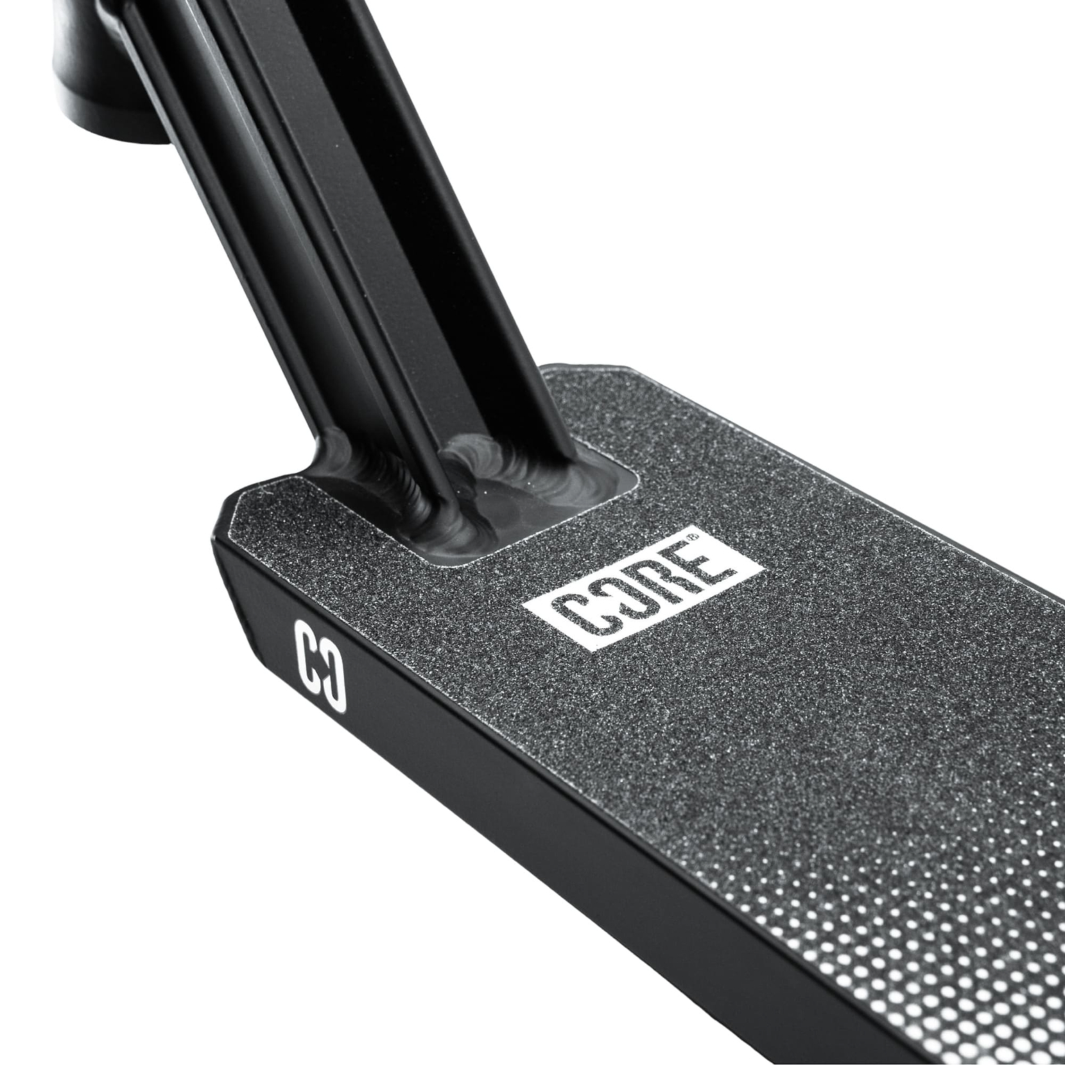 Close-up of the CORE CD1 Black / Chrome Stunt Scooter Deck by CORE, measuring 4.5″ x 19″. This lightweight aluminium deck features a textured grip surface and bold white “CORE” branding. Securely connected to the scooter’s neck, it’s an ideal choice for beginner riders looking for both style and durability.