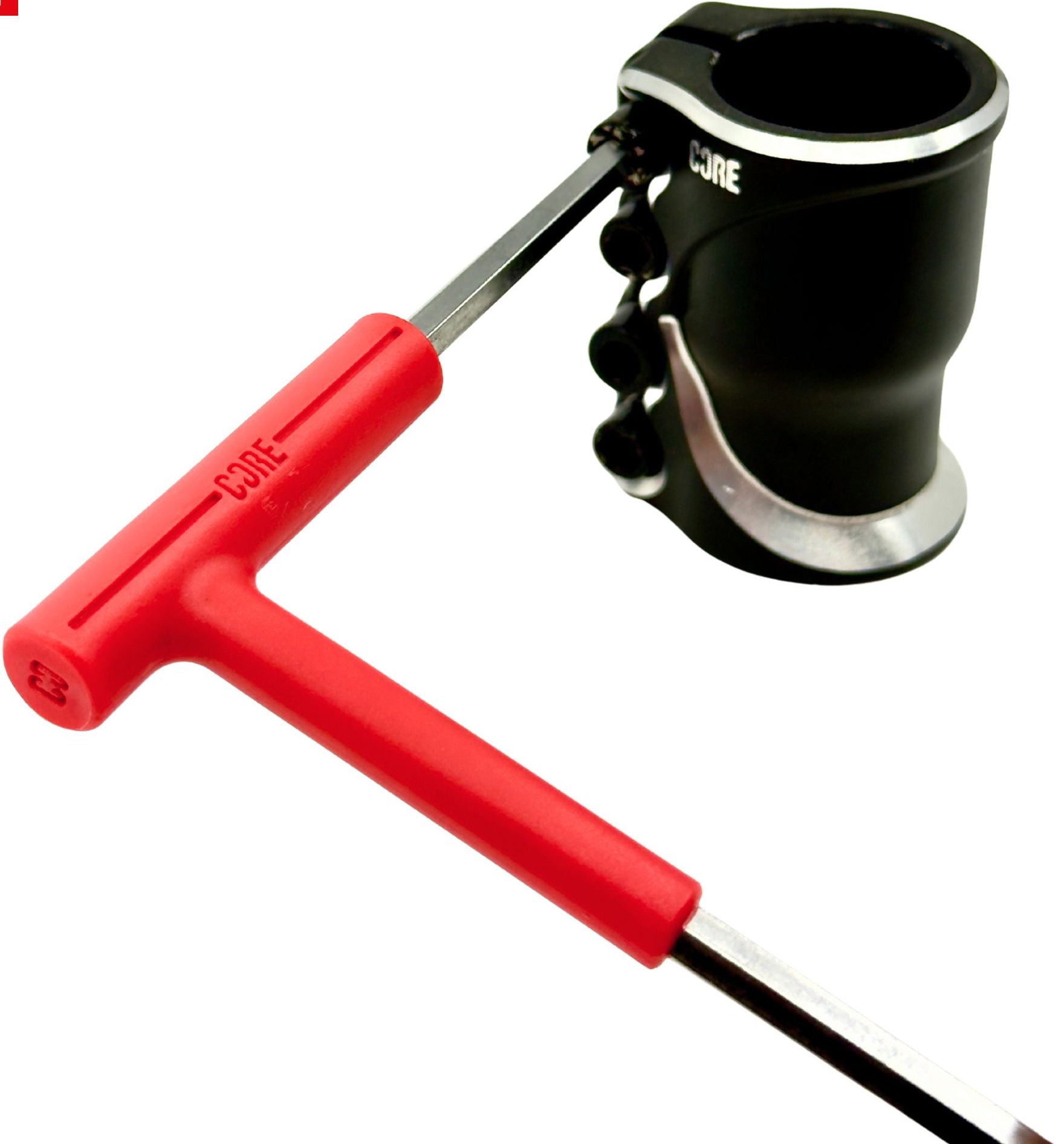 A CORE Hench Wrench 6mm Stunt Scooter Allen Key with a red handle is placed near a black and silver bicycle or scooter clamp, both displaying the CORE brand name.