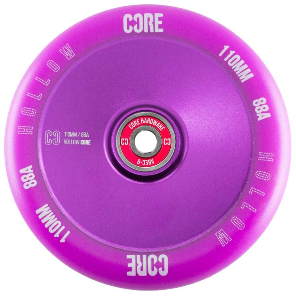 Introducing the CORE Hollow Core V2 110mm Stunt Scooter Wheel in Purple, this vibrant wheel showcases a sleek hollow core design with the engraved text "CORE," "HOLLOW," "110MM," and "88A." Its central bearing is adorned with striking red color and white text, engineered to ABEC-9 standards for ultimate performance.
