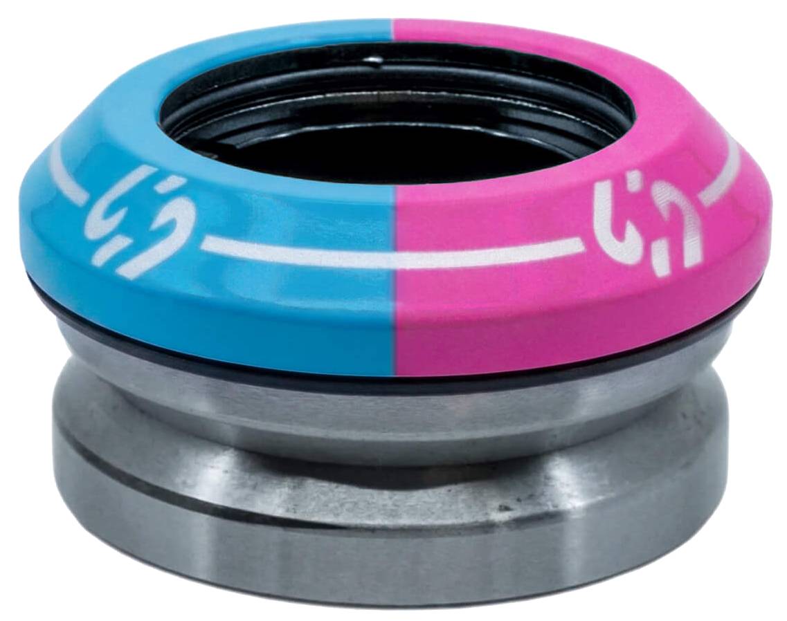 The CORE Icon Integrated Stunt Scooter Headset - Pink/Blue by CORE features a split blue and pink top cap with white markings and a metallic lower bearing cup, showcasing the distinctive CORE Icon style found on premium stunt scooter headsets.