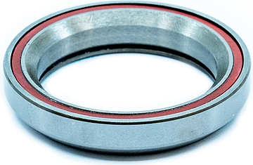 A round CORE Universal Integrated Headset Bearing replacement featuring a red rubber seal.