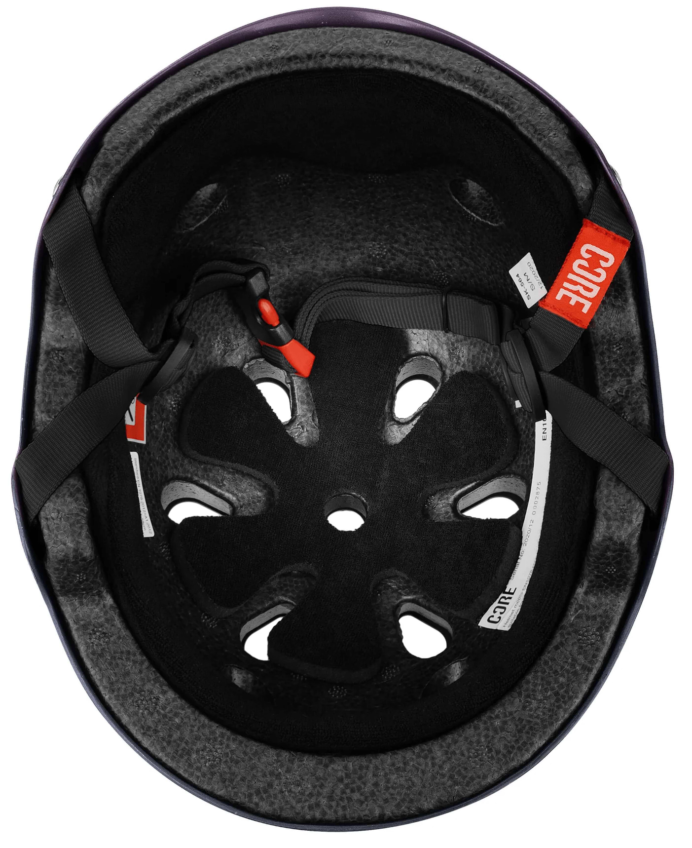 Inside view of the CORE Street Skate / Scooter Helmet - Neo / White by CORE, showing foam padding, ventilation holes, adjustable black straps with a red buckle, and a white label marked "CORE.