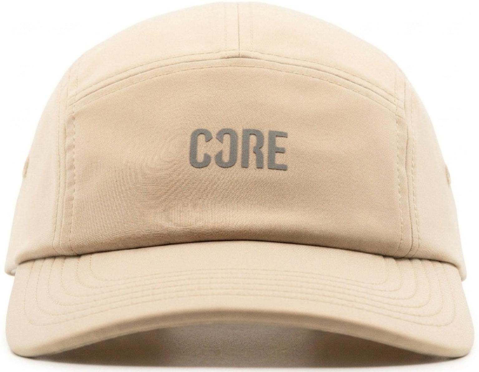The CORE Performance Cap - Sand / Reflective by CORE features the word “CORE” in reflective gray uppercase letters on the front panel, crafted from breathable fabric and displayed against a white background.