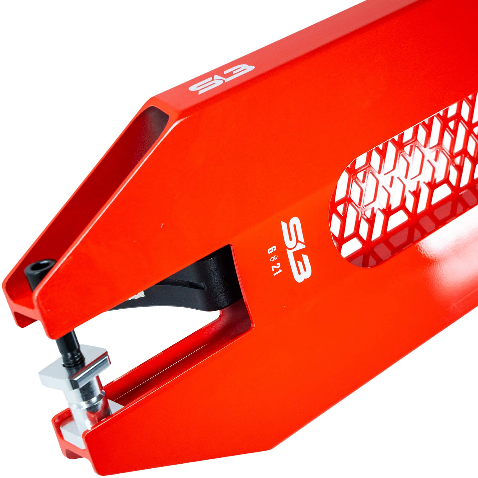 Close-up of a red, industrial metal device with a honeycomb pattern, labeled “S13.” The mechanism on the left resembles a clamp or pressing tool, similar to the solid construction featured in the CORE SL3 Forged Candy Red Stunt Scooter Deck by CORE—a vibrant 6″ x 21″ deck celebrated for its strength and precise engineering.