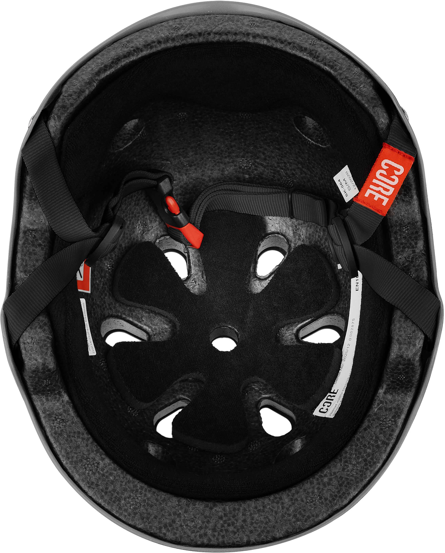 Top view of the inside of the grey CORE Street Skate / Scooter Helmet featuring foam padding, ventilation holes, adjustable straps, and a red buckle—hallmarks of CORE’s helmet design for a secure and comfortable fit.