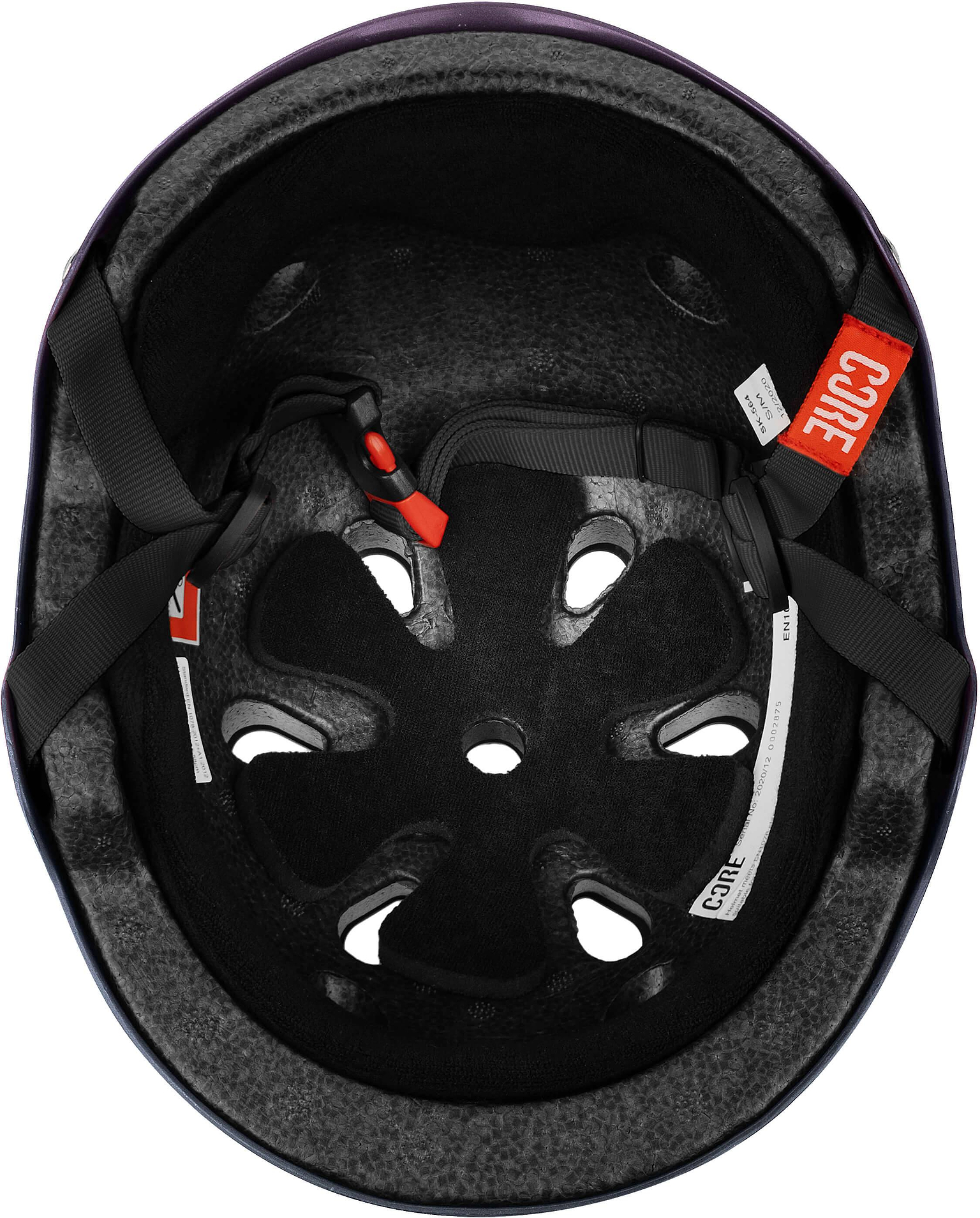Inside view of the CORE Street Skate / Scooter Helmet - Neo / Black by CORE, showing foam padding, ventilation holes, adjustable straps, and CORE safety label—ideal as a street or skate helmet for reliable protection.