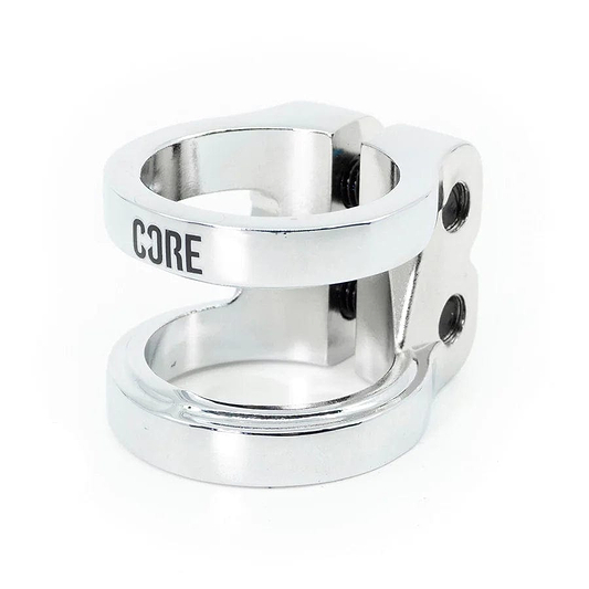 The CORE Venom 2 Bolt Oversized Stunt Scooter Clamp - Chrome is a CNC machined aluminum clamp from CORE, featuring an engraved "CORE" logo on its sleek surface. Its cylindrical design includes smooth, polished chrome surfaces with two screws and circular openings, offering a balance of strength and lightweight functionality.