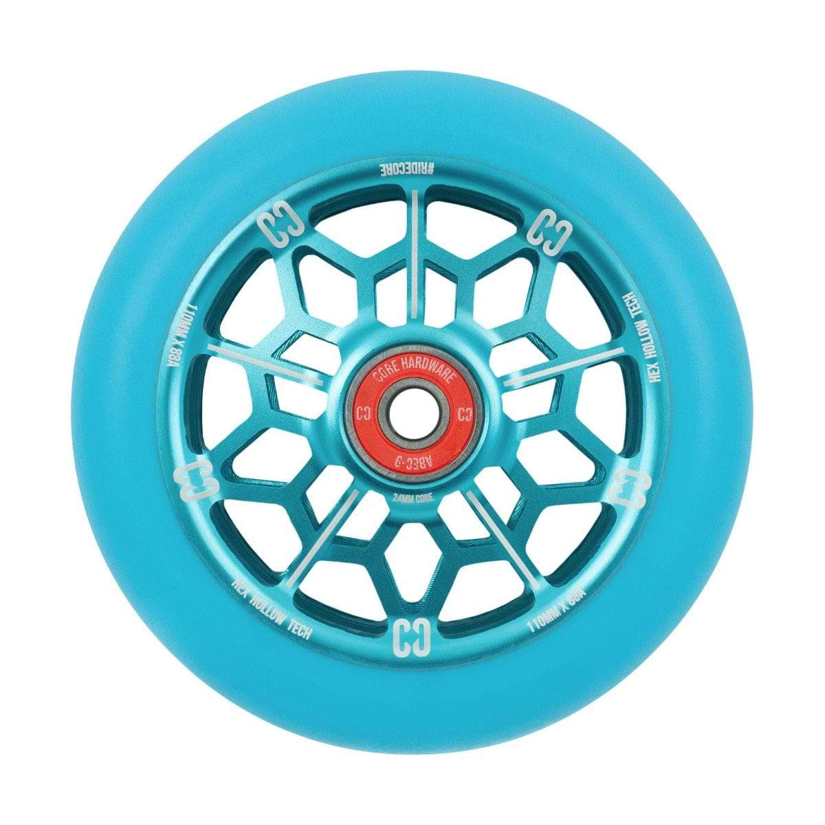 A detailed view of the CORE Hex Hollow Core 110mm Stunt Scooter Wheel in Mint Blue highlights its distinctive honeycomb design and HEX Hollow Technology within the spokes. The silver hollow core features red accents, while white markings around the rim enhance its sleek appearance, promising smooth rides with ABEC 9 bearings.