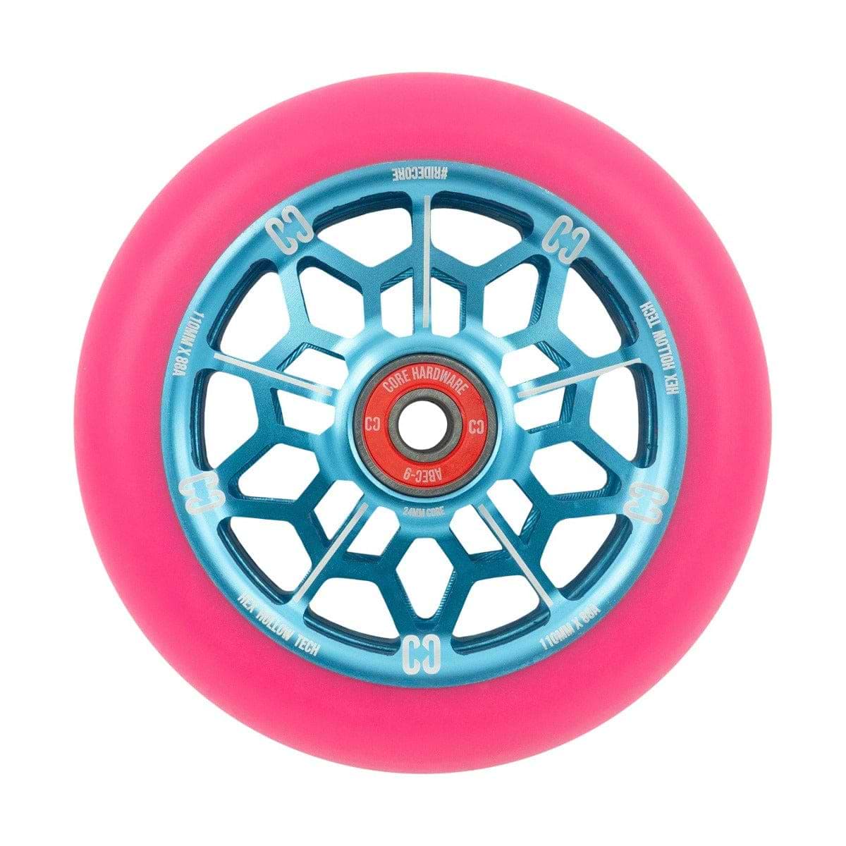 The CORE Hex Hollow Core 110mm Stunt Scooter Wheel in vibrant pink and blue features a web design with blue metallic spokes and an 88a compound for superior grip. The red central hub is detailed with text and logos, while the ABEC 9 bearings ensure a smooth ride. Its Hex Hollow Core enhances performance on any stunt scooter.