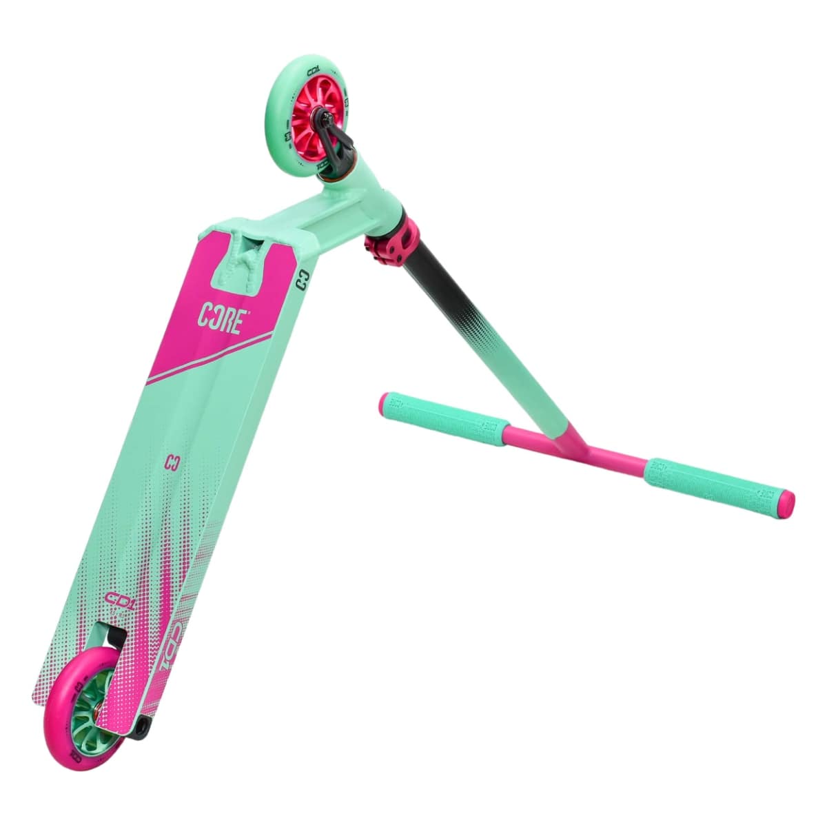 The CORE CD1 Complete Stunt Scooter from CORE is ideal for beginner riders, showcasing a lively teal and pink color scheme. It includes an eco-friendly handlebar, wide deck, T-bar grips, and small wheels specifically designed for tricks and maneuvers.