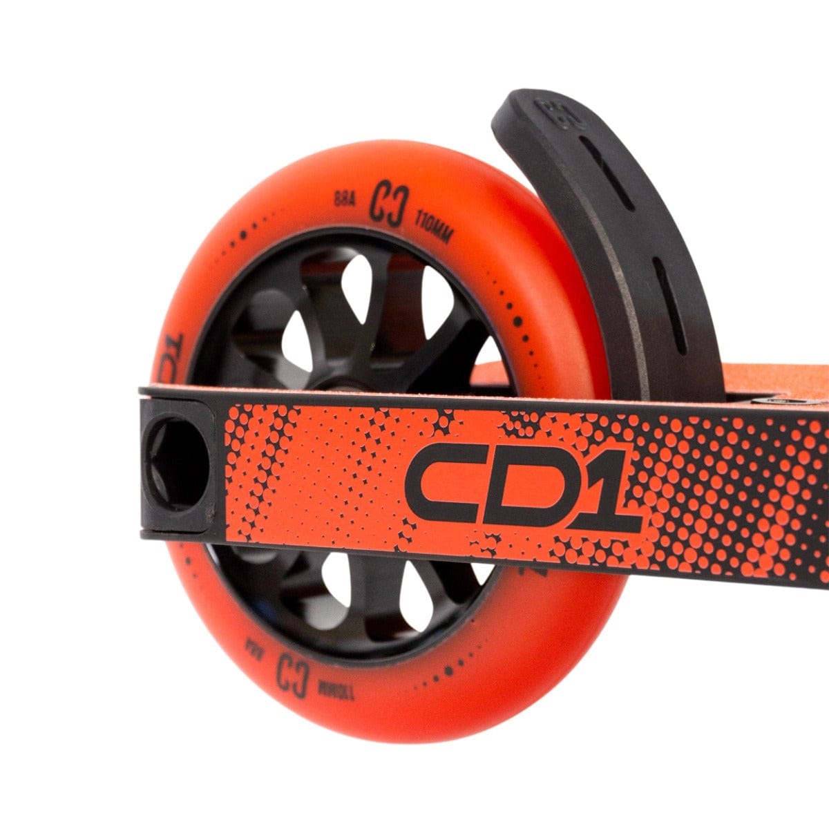 Close-up of a vibrant orange-red wheel from the CORE CD1 Complete Stunt Scooter, featuring a black frame with a dotted design and branded as "CD1." Perfect for beginner riders, the wheel is marked with the text "C3.