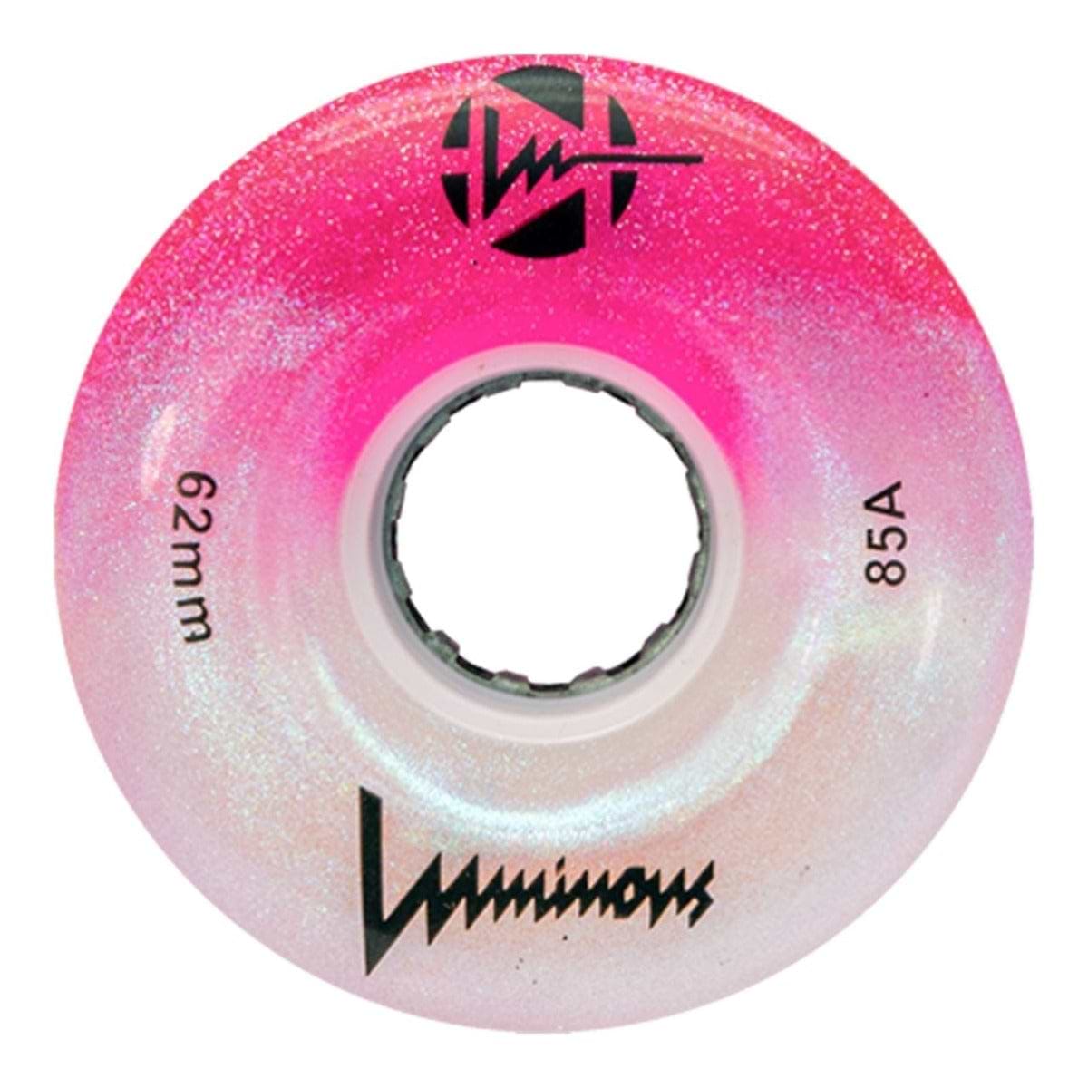 The Luminous LED 85A Quad Roller Skate Wheel in Cotton Candy (62mm) by Luminous features a pink and white glittery finish, stylized branding, “85A” durometer, and a center hole for the axle.